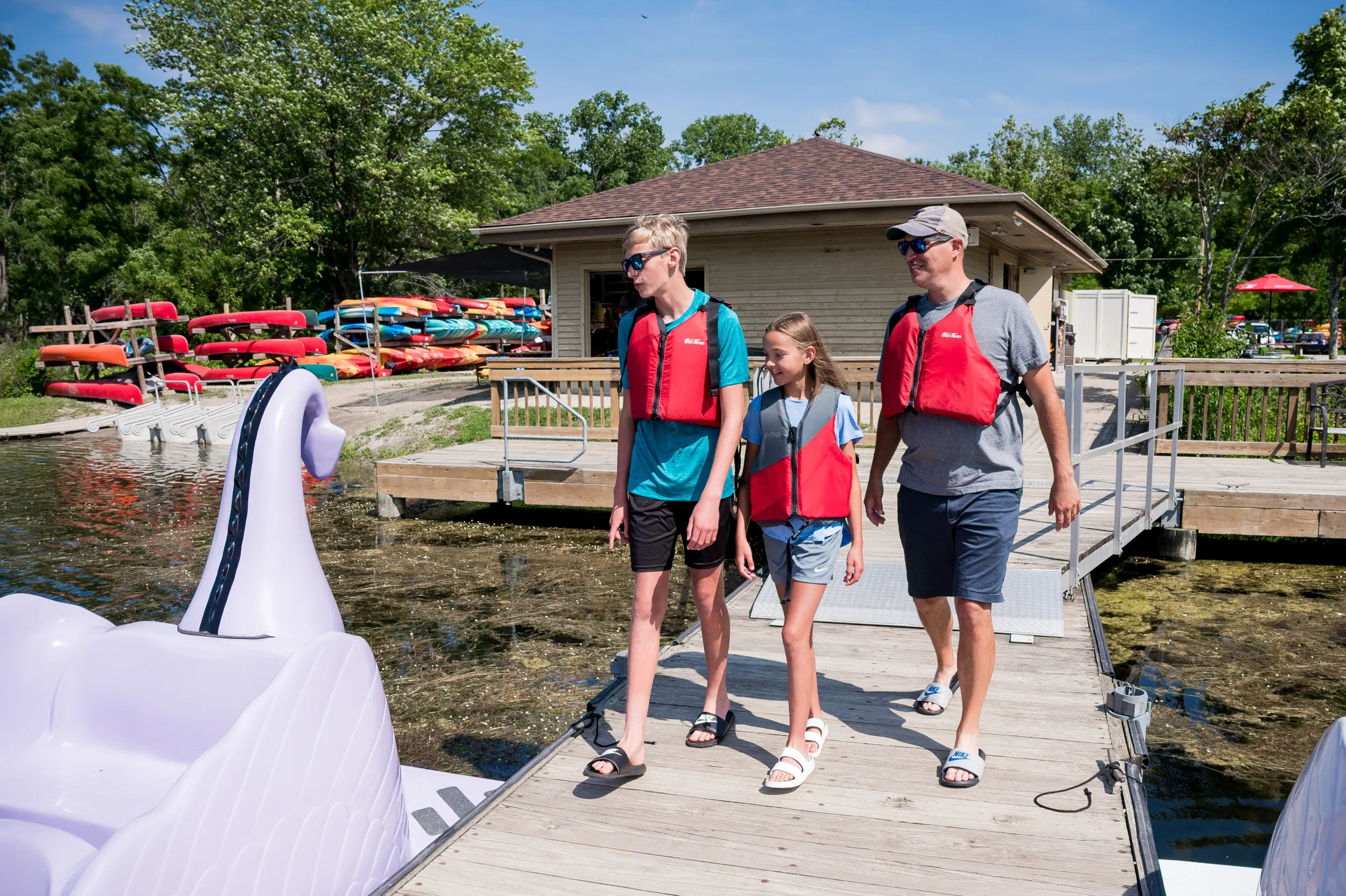 People walking on boat rental dock